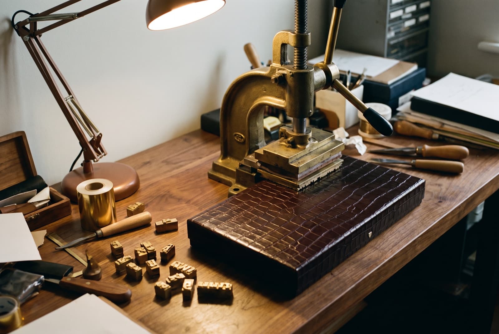 The brass letterpress used to strike the gold-foil monogram